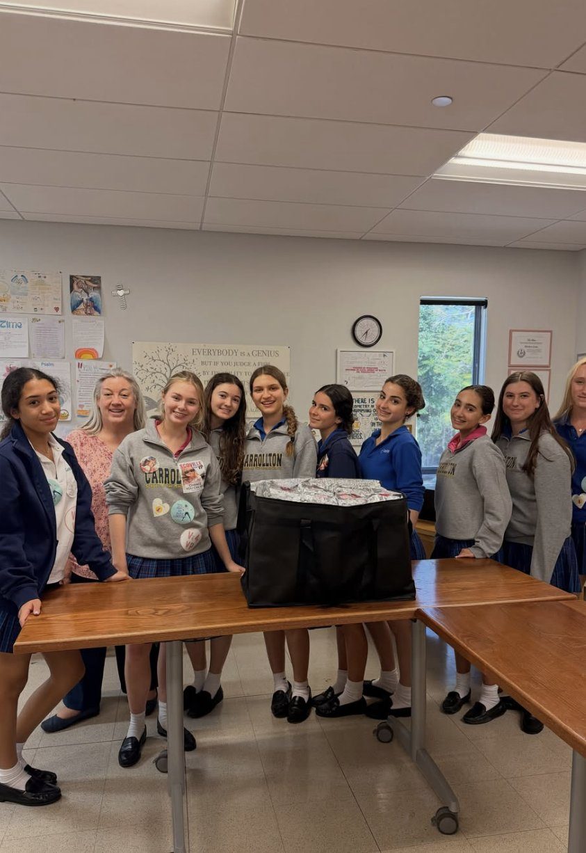 Volunteers with a packed delivery bag